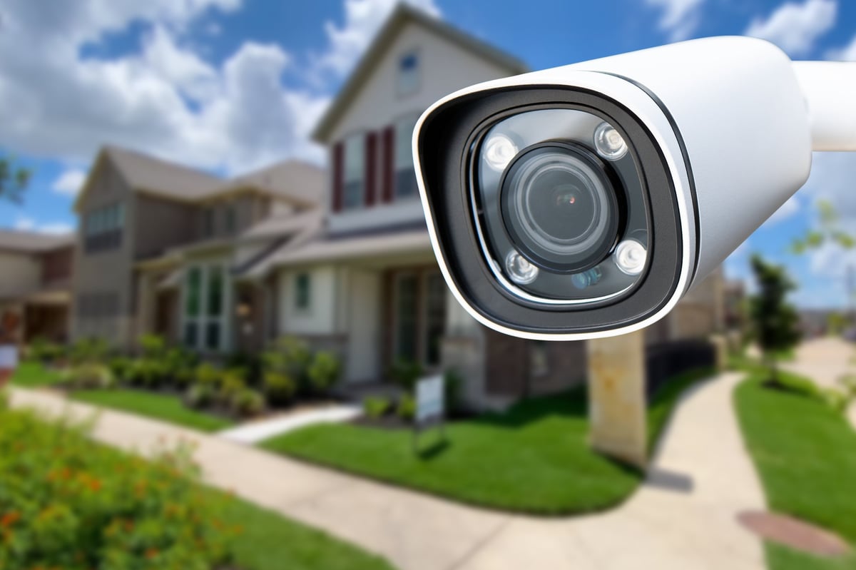 Security camera mounted on the exterior of a private home